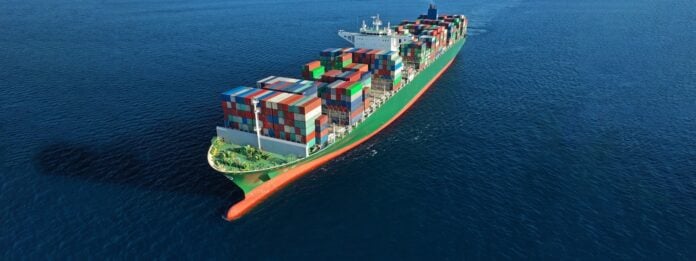 Aerial drone ultra wide photo of huge colourful truck size container tanker vessel cruising deep blue open ocean sea DHL Henkel Sustainable Marine Fuel